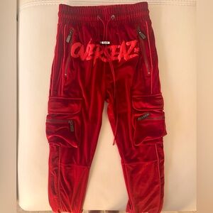 40% OFF GUAPI OVERSEAZ TRACK PANTS IN RED